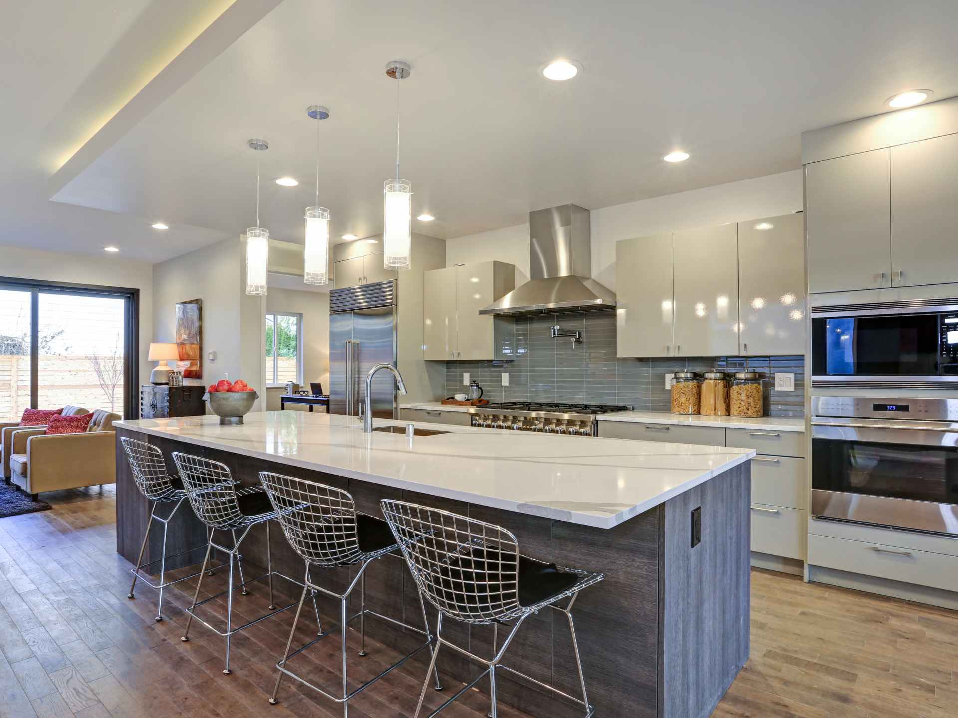 A kitchen with a large island and lots of counter space.